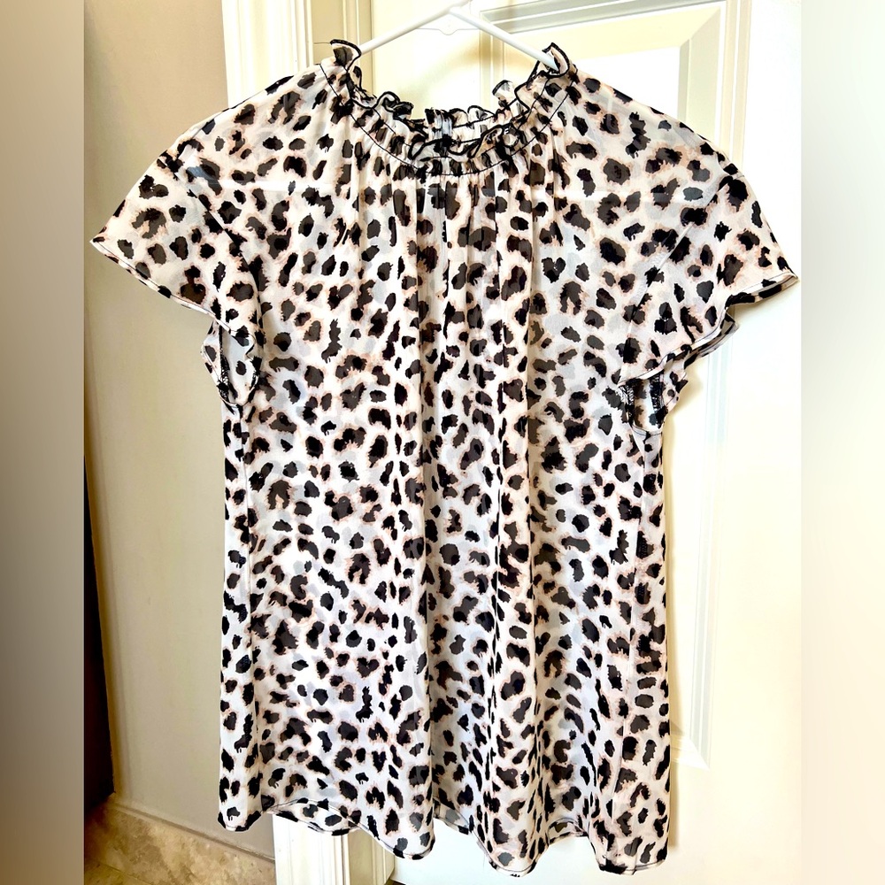 Express sheer top like new size M.  White background with black and cream print.
